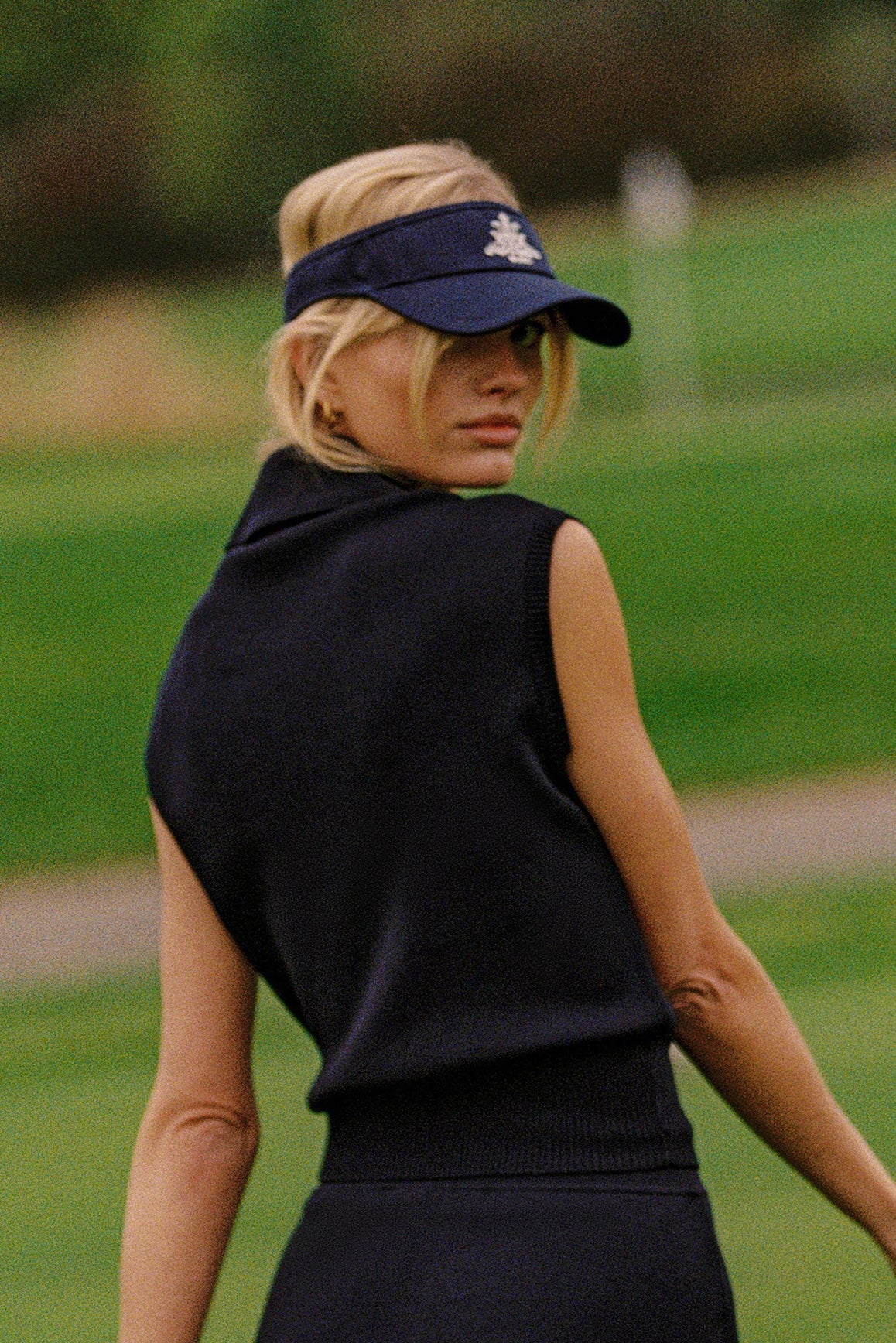 WISKII cap-sleeve knit polo tank top in soft fabric, featuring a classic polo collar and relaxed fit.