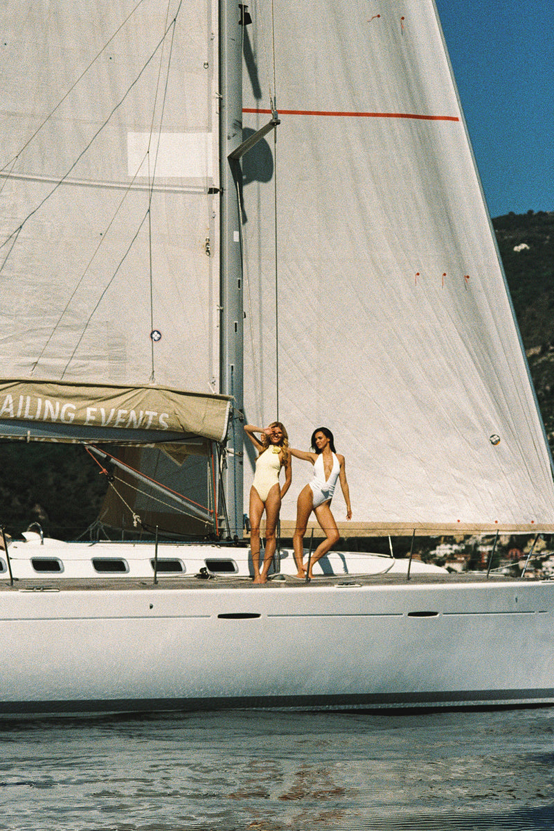 Model wears a Ivory Riviera Floral Plunge One-Piece Swimsuit | WISKII Swimsuit | WISKII Active