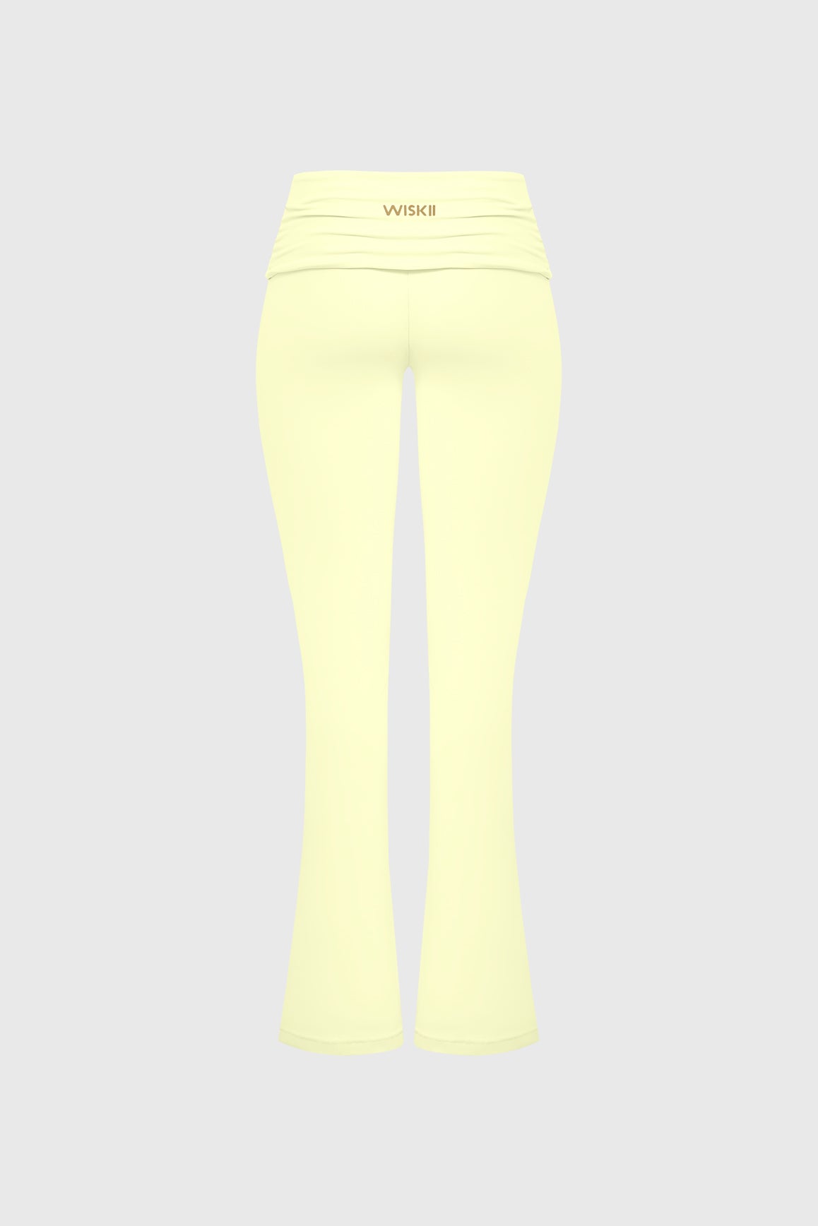 WISKII low rise scrunch flare leggings in black with fitted waistband and flared leg design, shown on a model.
