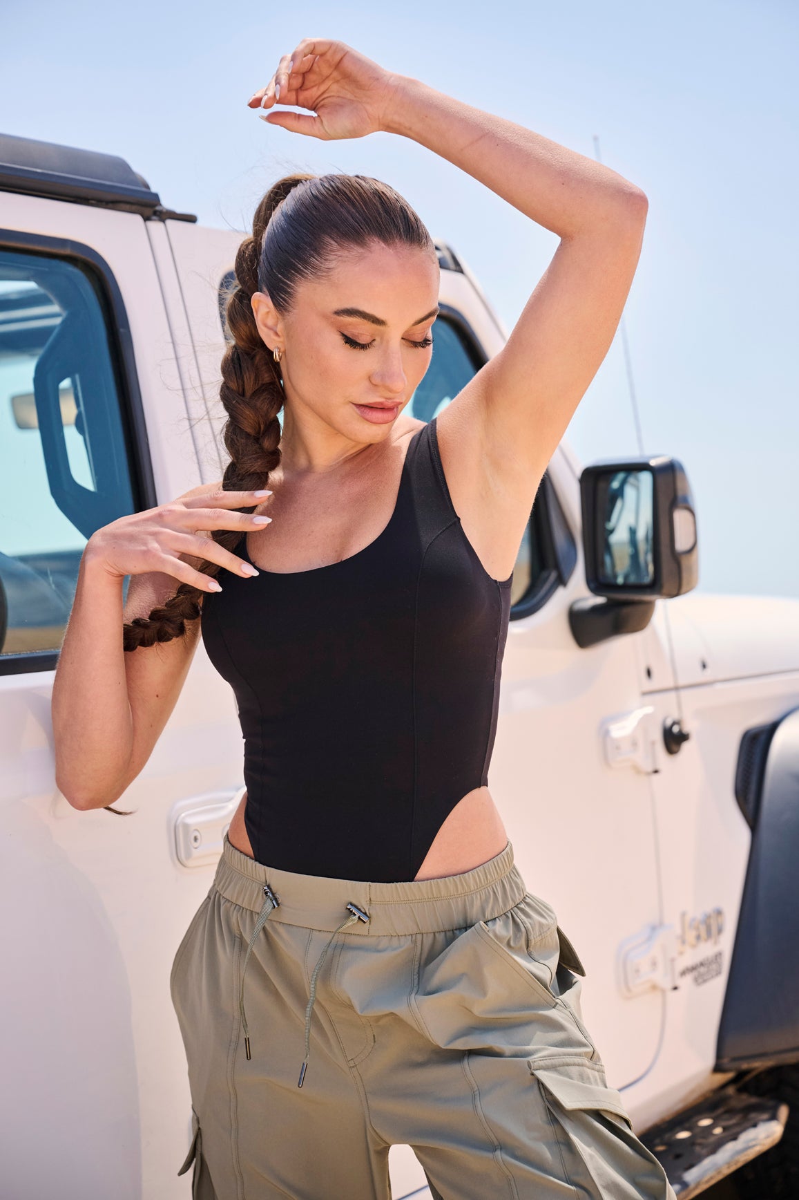 Model wears Scoop Neck Sleeveless Bodysuit | WISKII Active | Black