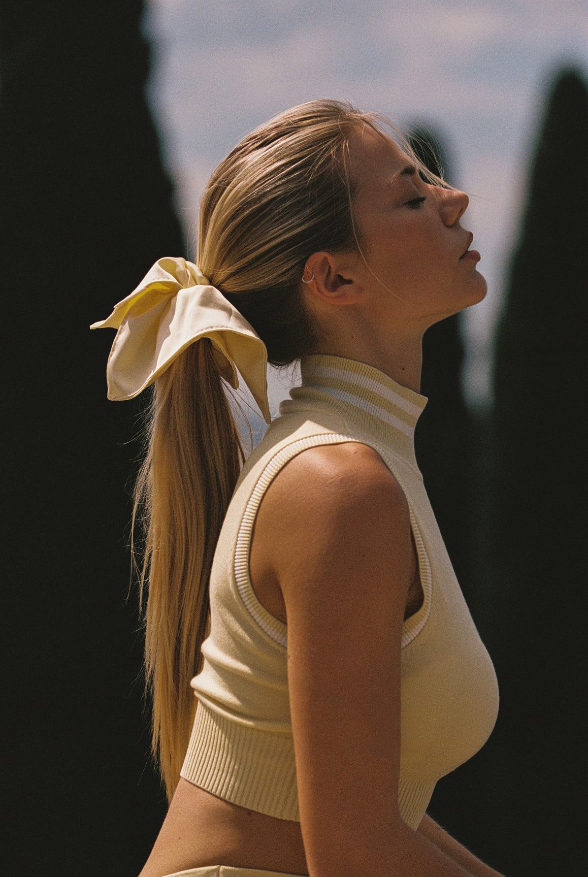 WISKII Mirto Knit Mock Neck Tank in lemon chiffon, cropped sleeveless top with a mock neck design.
