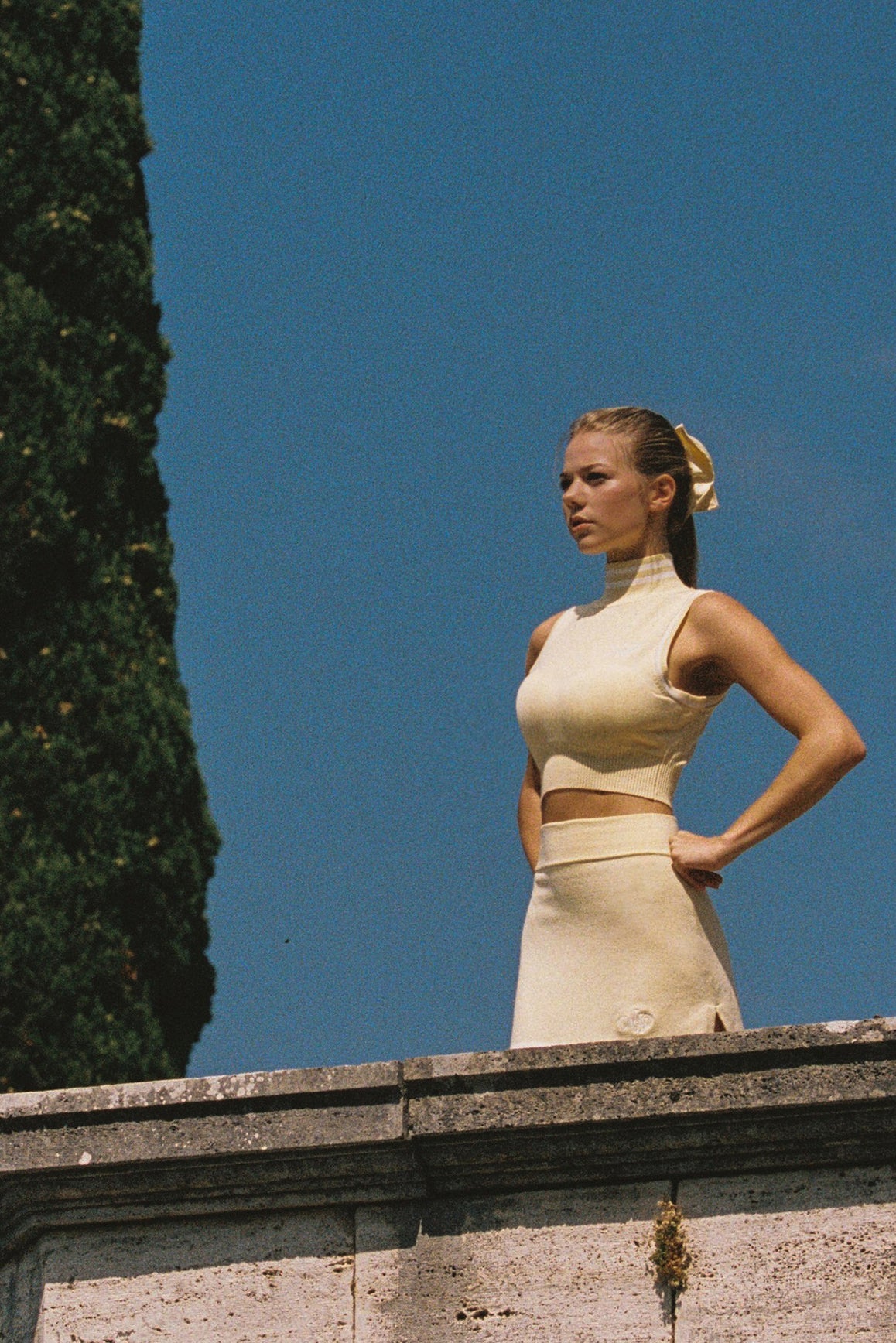 WISKII Mirto Knit Mock Neck Tank top in lemon chiffon, close-up of lightweight knit fabric and mock neck design.