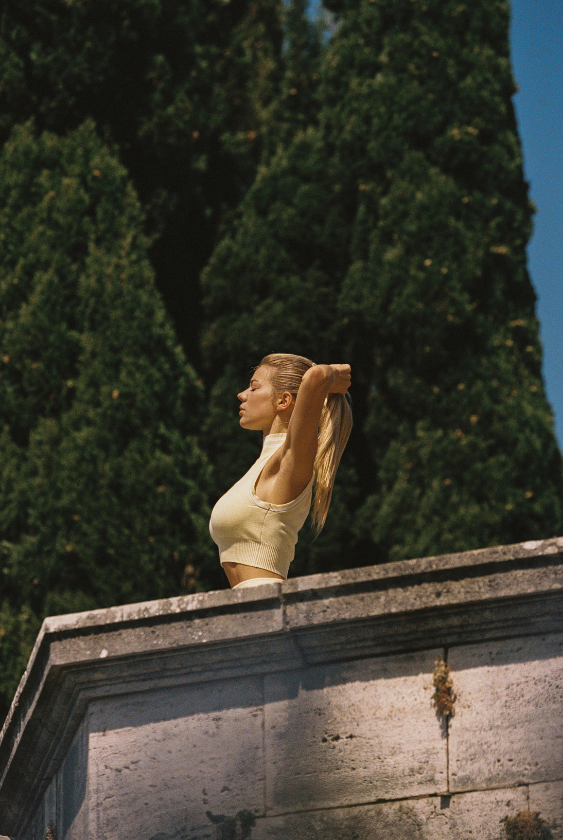 WISKII Mirto Knit Mock Neck Tank top in lemon chiffon, close-up of the sleeveless knit design and mock neckline.