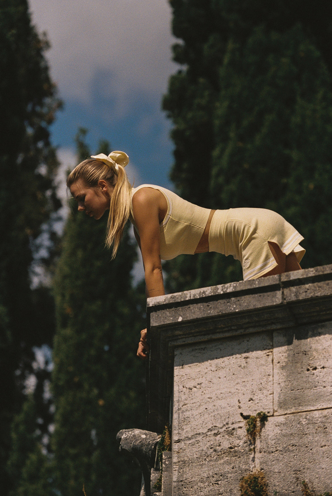WISKII Mirto Knit Mock Neck Tank in lemon chiffon, featuring a sleeveless design and ribbed knit fabric.