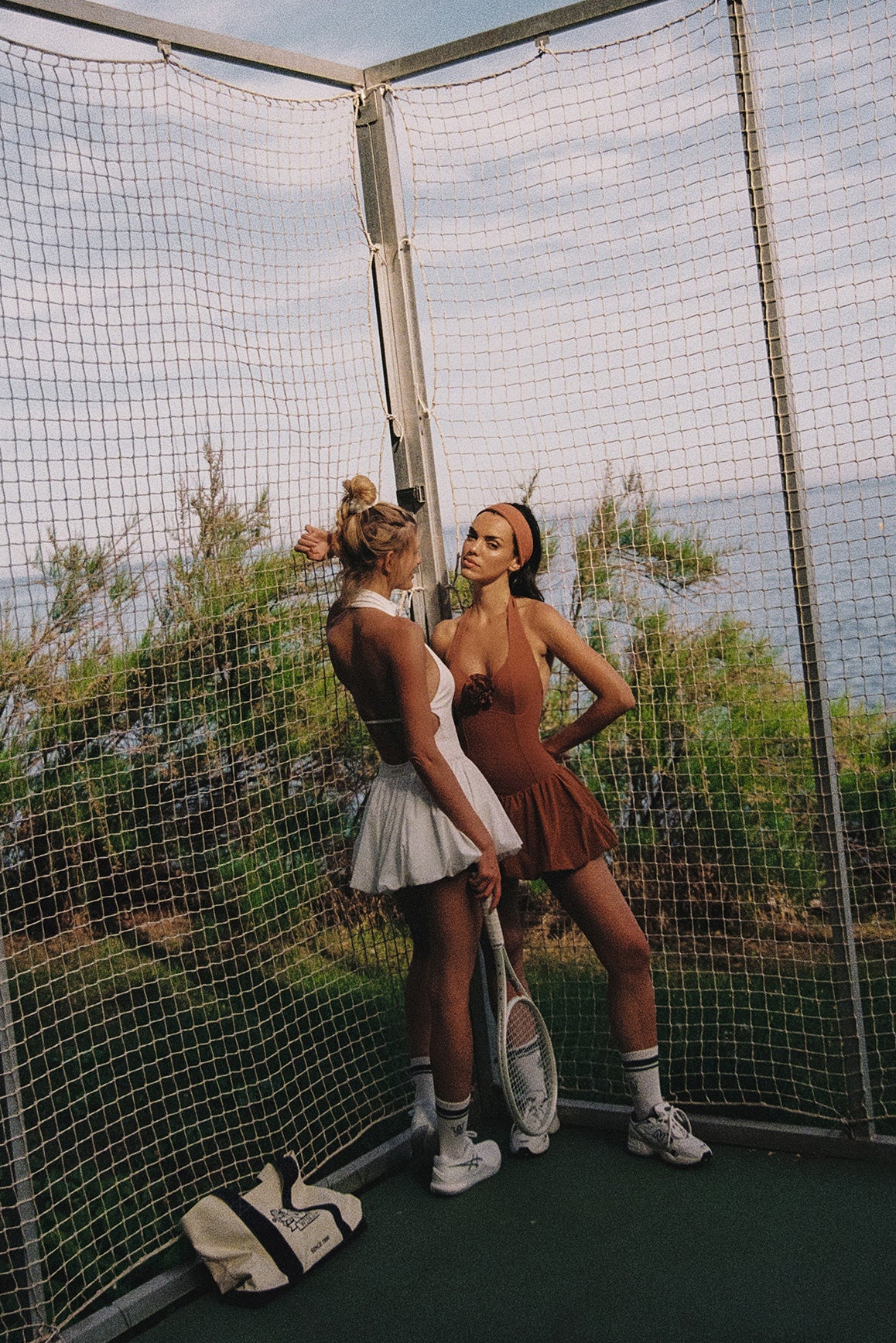 Model wears a Riviera Floral Halter Mock Neck Dress | Ivory | WISKII Active