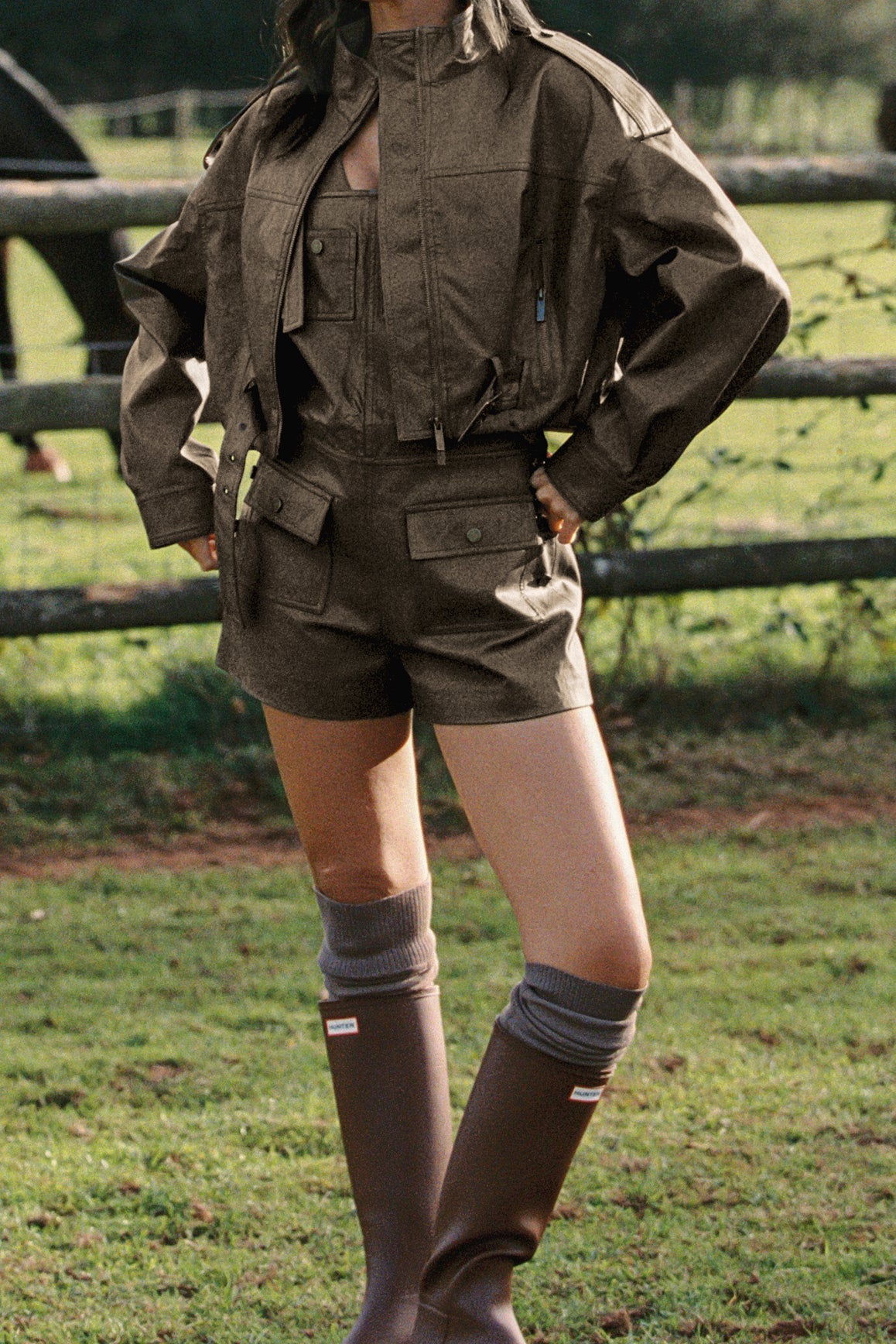 WISKII faux leather overall shorts in taupe, featuring a stylish design with adjustable straps and a relaxed fit.