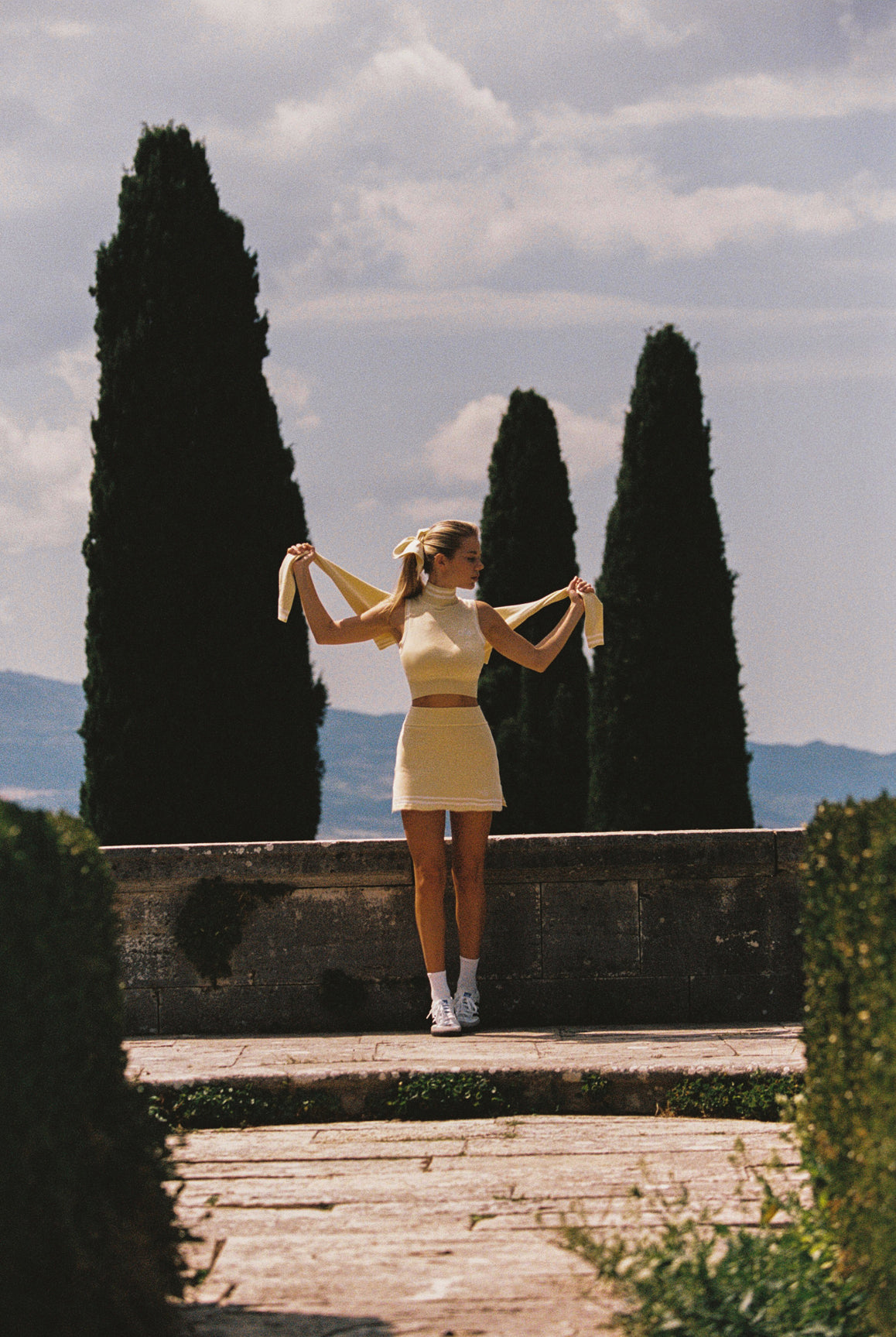 WISKII Mirto Knit Mini Skirt in lemon chiffon, featuring a fitted design, soft knit fabric, and stylish mini length.
