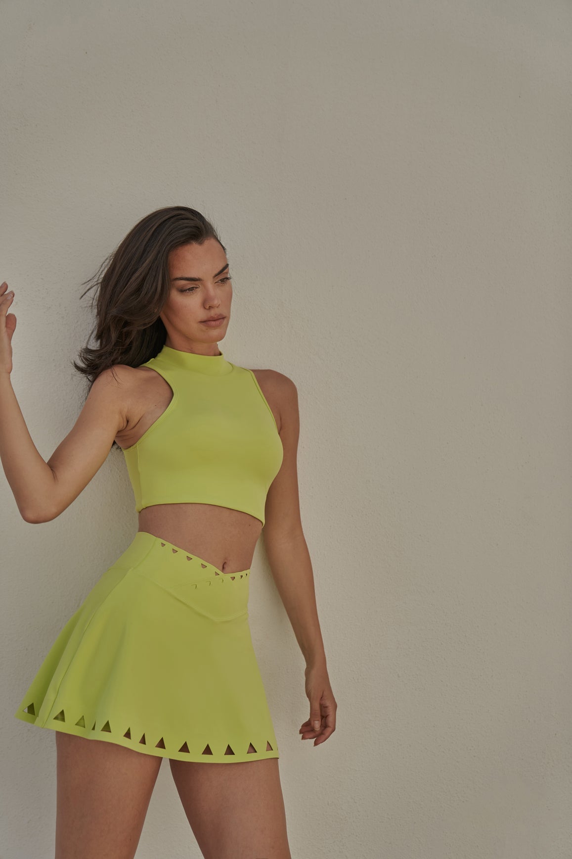 WISKII Diamond Cutout Mock Neck Sports Bra in Bitter Lime, featuring a stylish cutout design and supportive fit.