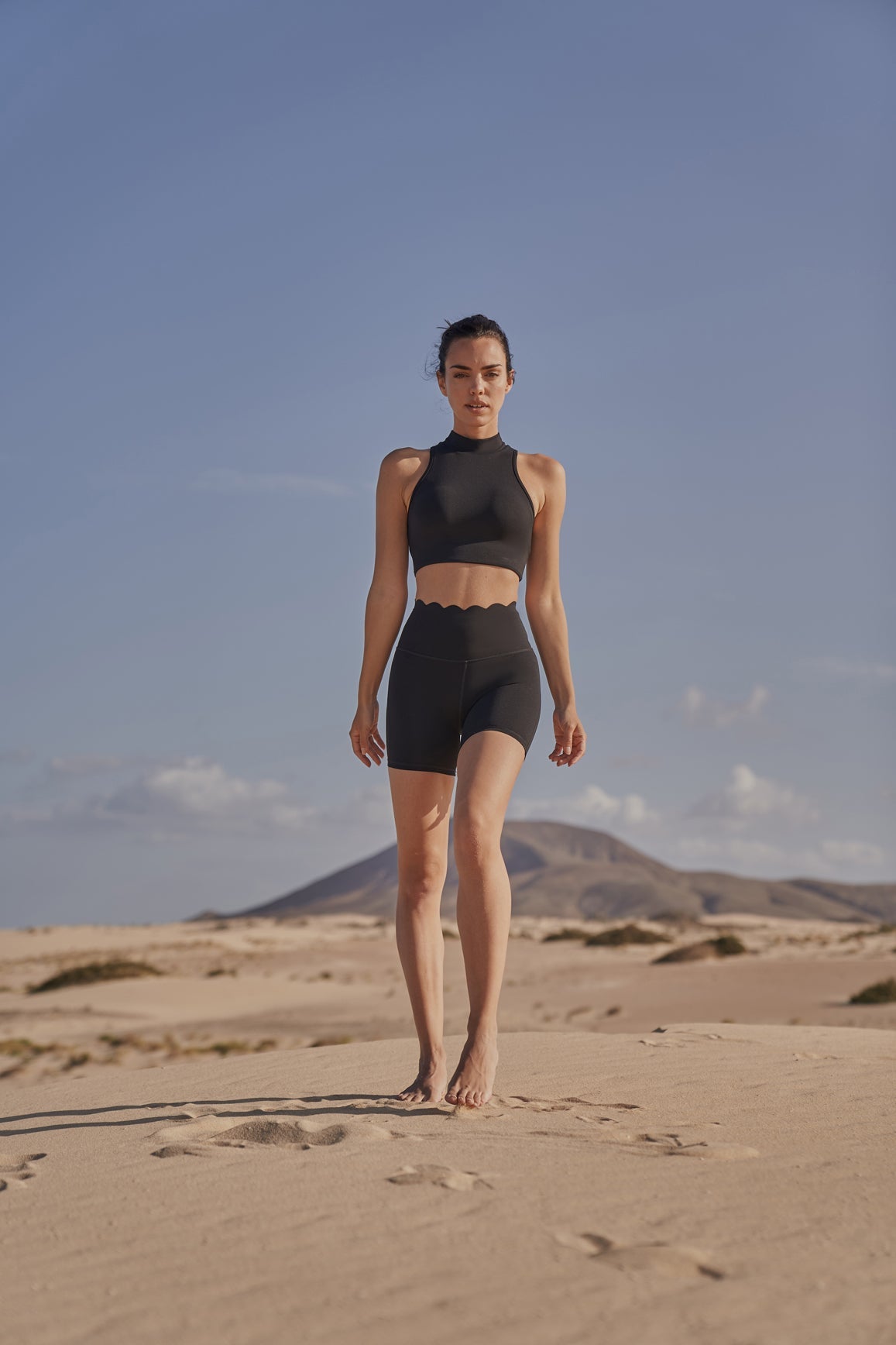 Black Diamond Cutout Mock Neck Sports Bra by WISKII, featuring a stylish design and supportive fit for active wear.