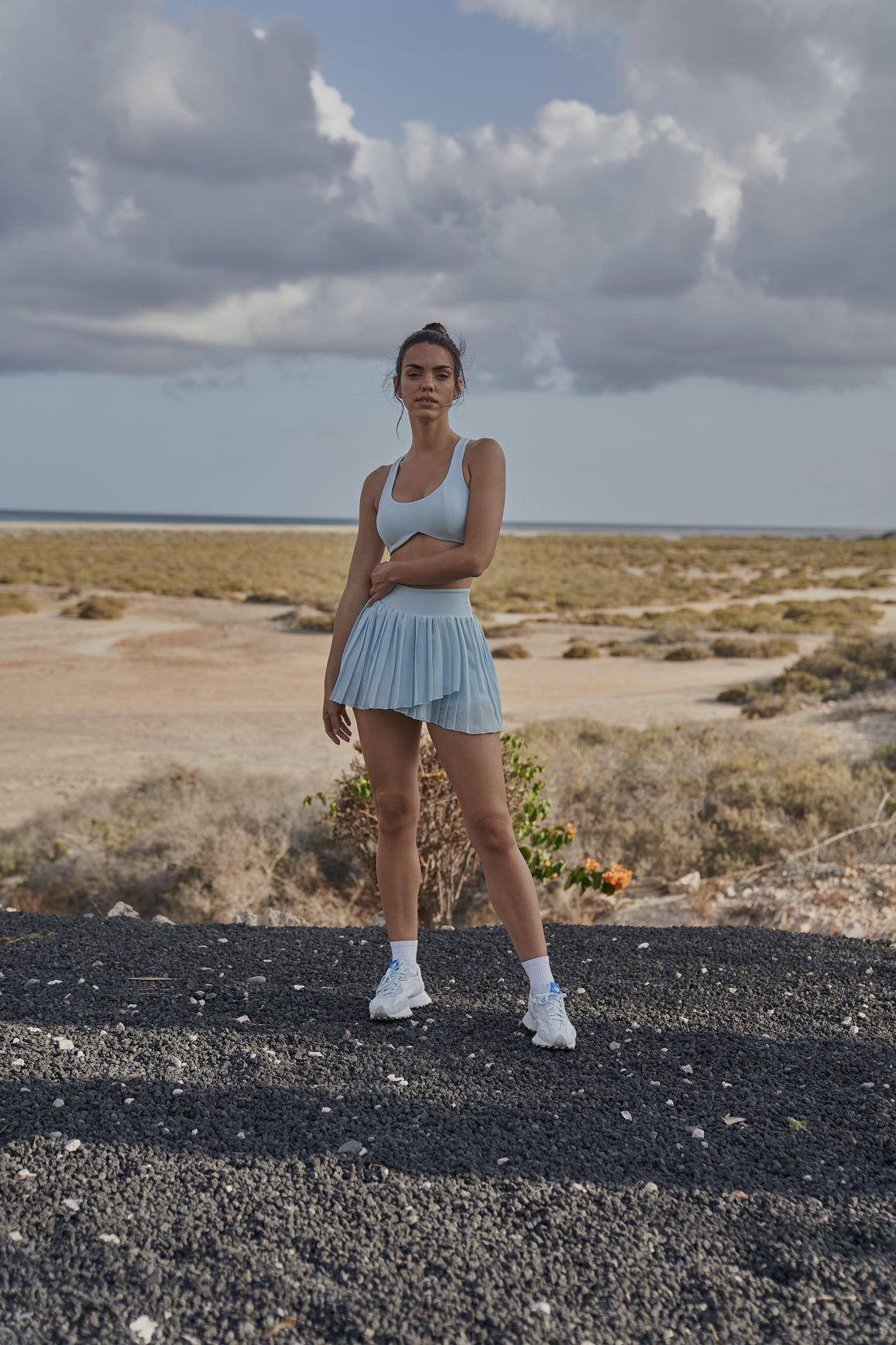 Ivory WISKII Dreamy Cutout Sports Bra with stylish cutouts, designed for comfortable yoga and active wear.