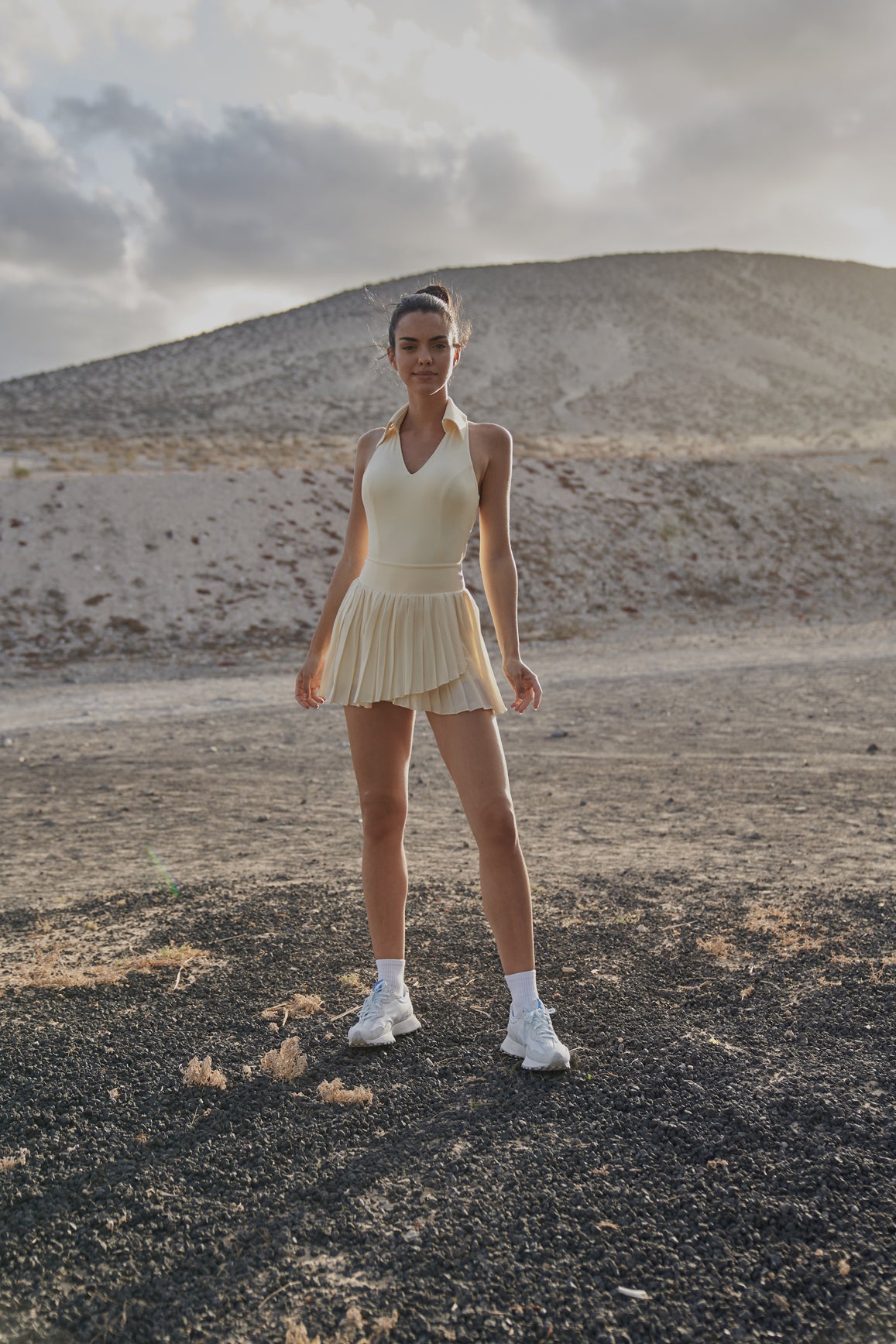 Ivory sleeveless polo tank top by WISKII, featuring a classic polo collar and sleeveless design, perfect for casual wear.