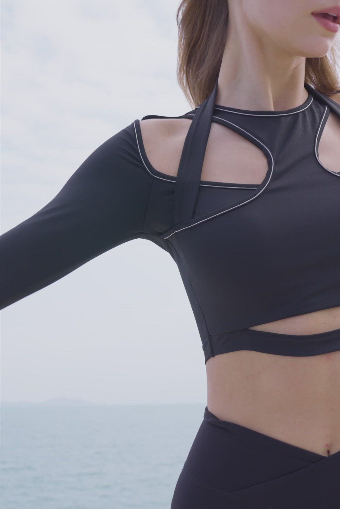 model wears a WISKII Flex Sports Long Sleeve Crop Top