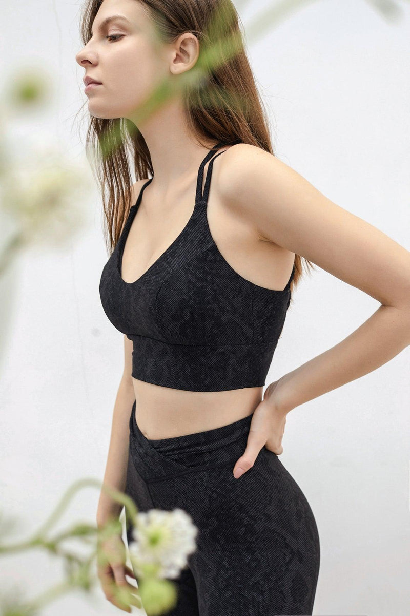 model wears a graphic geo sports bra