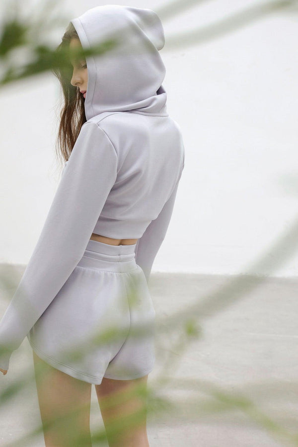 model wears a WISKII Crop Hooded Jacket